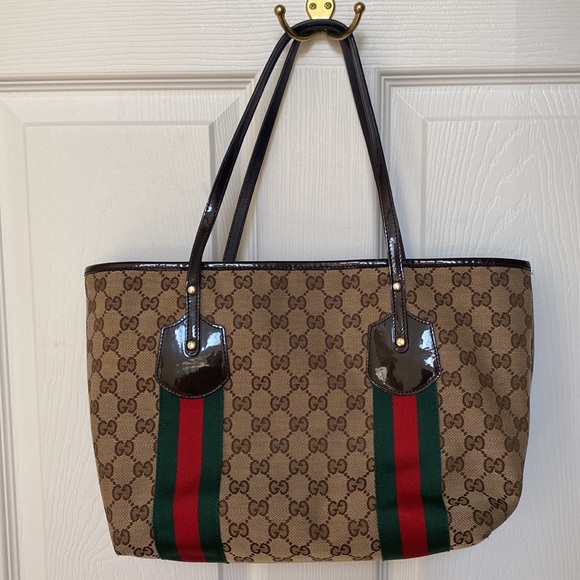 Authentic Gucci brown monogram canvas tote!With three charms.Near perfect! - Picture 9 of 14